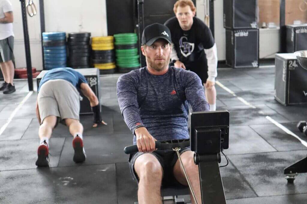 man in cap training in the gym